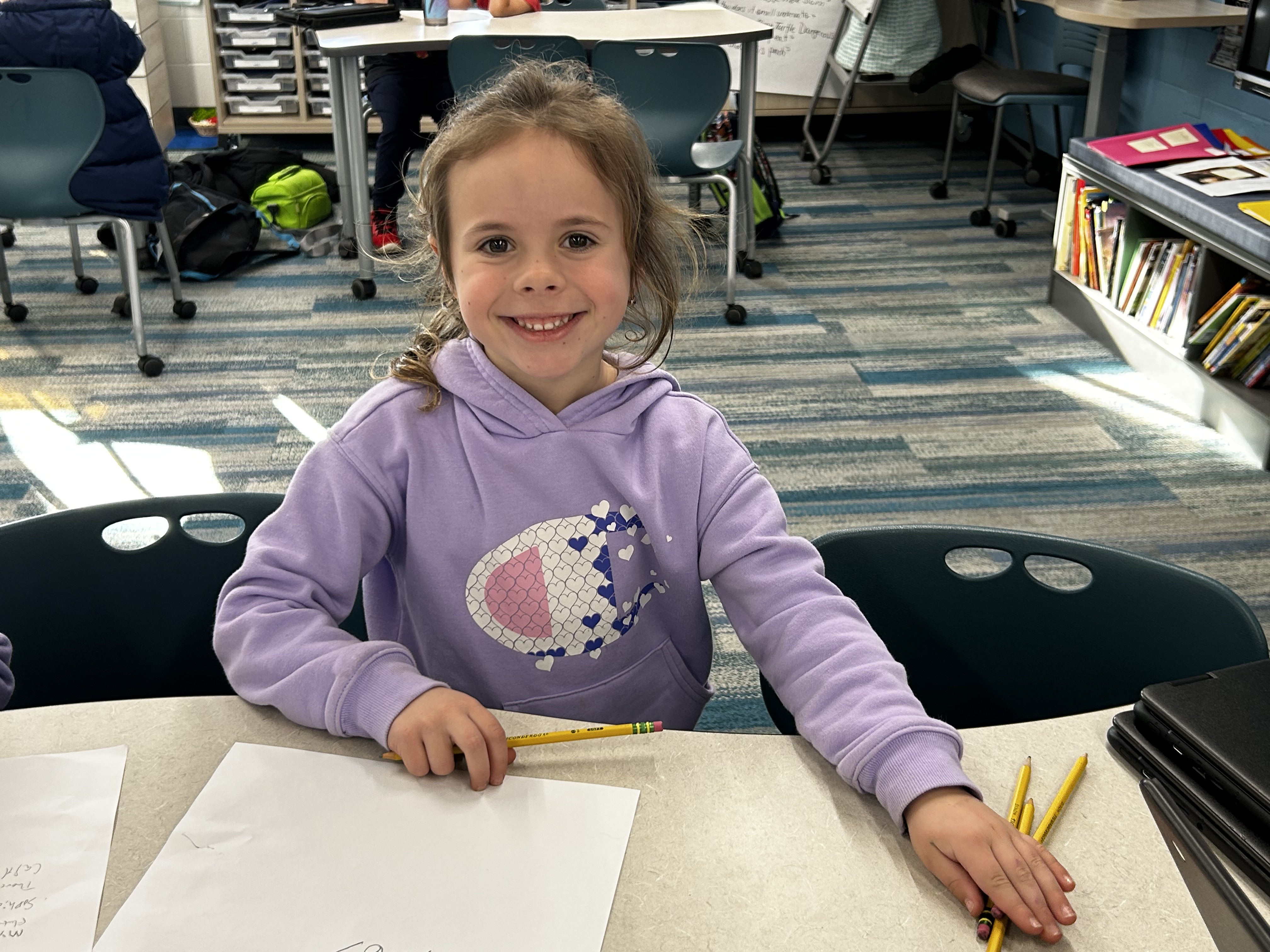 Student designing with pencil and paper